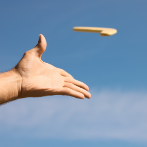 A hand having just thrown a boomerang representing Emotion-Focused Therapy techniques