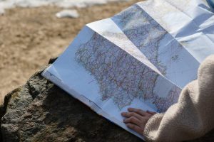 A person reading a roadmap to depict Core Pain and Case Formulation in Emotion-Focused Therapy