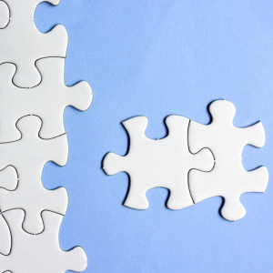 A puzzle with two pieces locked together off to the side representing Challenges and Opportunities in therapy